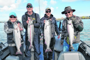 These fishers got their spring Chinook while fishing the Columbia River with Matt Halseth. Anglers are hoping for better river conditions this year, since high, cold water bedeviled the fishing in 2025. (Photo courtesy Matt Halseth)