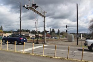 Traffic proceeds north on 32nd Street across a set of railroad tracks in Washougal on March 31, 2022. (Doug Flanagan/The Columbian files)