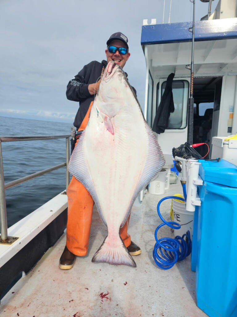 This 63-pound halibut was caught last year out of Ilwaco with Sea Breeze Charters. Halibut season starts May 1. (Photo courtesy Sea Breeze Charters)