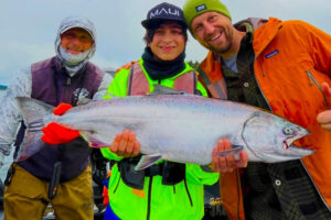 Smiles all the way around as happy anglers hold a chinook salmon taken last year in the Columbia River. If conditions in the river and ocean are good this year, anglers should enjoy a fine year for both ocean and river salmon. (Photo courtesy Bill Monroe Outdoors)