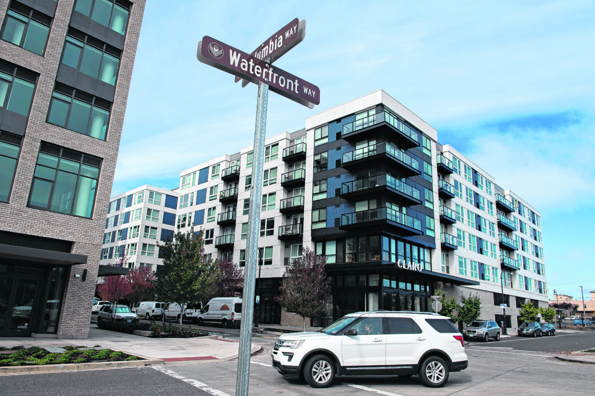 Multifamily buildings larger than 20,000 square feet, like the Broadstone Claro apartments, right, at The Waterfront Vancouver, are one of the types of buildings that will be beholden to the new Washington Clean Buildings Performance Standard. (Amanda Cowan/The Columbian files)
