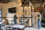 Owners Jon Borth, left, and Rod Edwards move scaffolding on Monday at Shoug&rsquo;s Draft House in Washougal. (Photos by Taylor Balkom/The Columbian)