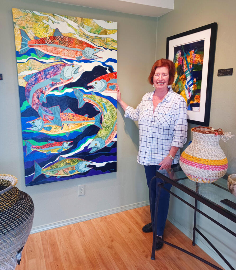 Artist Marie Powell stands next to one of her newest paintings inside the Marie Powell Gallery, which also features paintings by Vancouver artist Gregory Gorham. (Photos by Monika Spykerman/The Columbian)