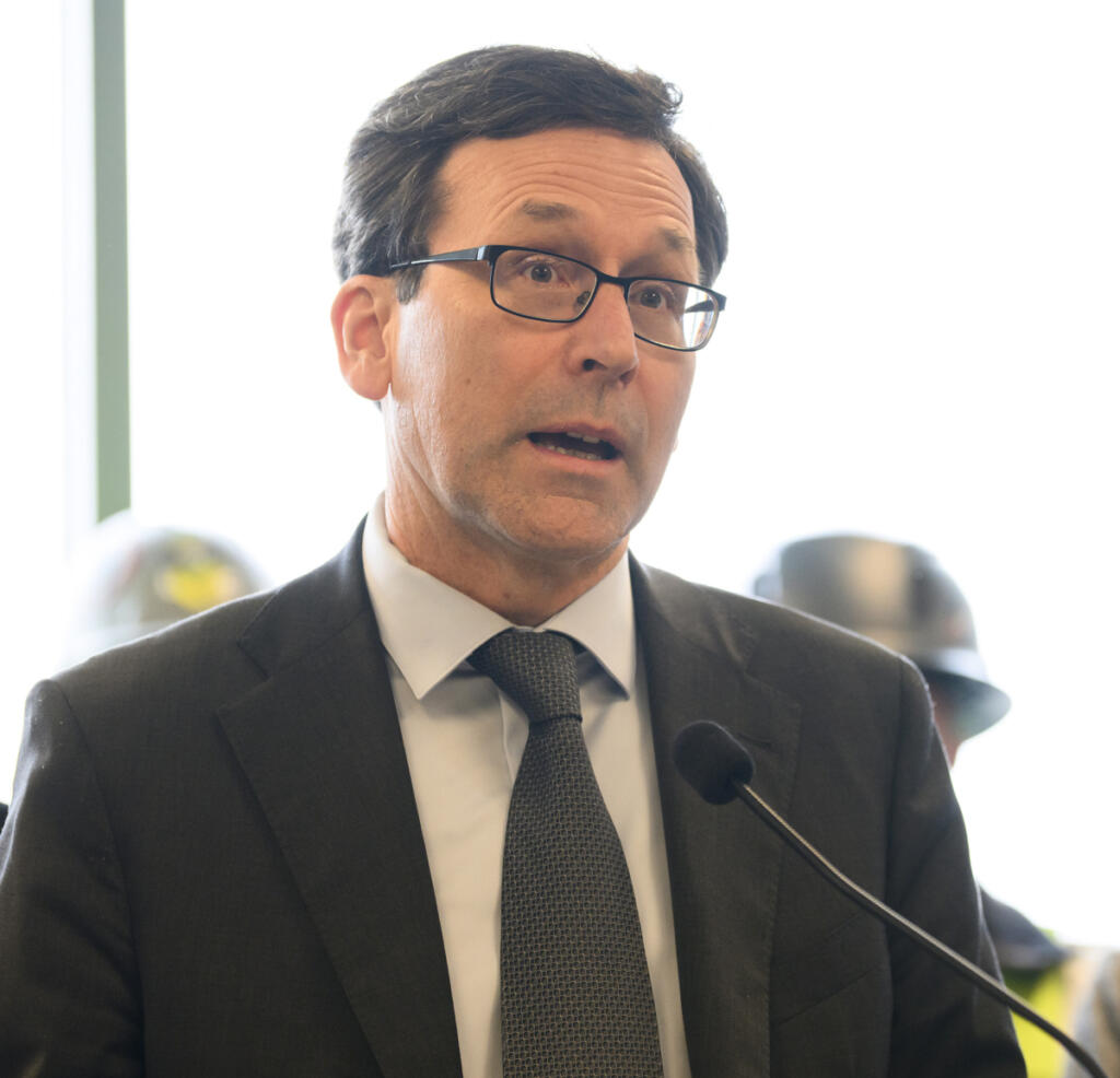 Washington Gov. Bob Ferguson speaks at a press conference Tuesday at the Interstate Bridge Replacement Program headquarters in downtown Vancouver. (Taylor Balkom/The Columbian)