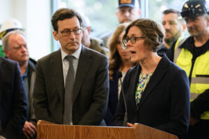 Interim Interstate Bridge Replacement Program Administrator Carley Francis, right, answers a question from a reporter Tuesday during a press conference at the Interstate Bridge Replacement Program headquarters in downtown Vancouver. (Taylor Balkom/The Columbian)