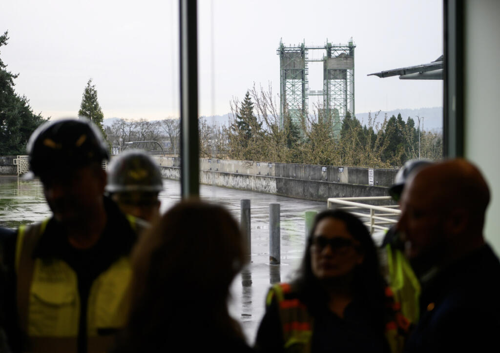 The Interstate 5 Bridge rises above the tree line Tuesday as seen from the Interstate Bridge Replacement headquarters in downtown Vancouver. (Photos by Taylor Balkom/The Columbian)