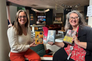 Kimberly Lottig, Skyridge Middle School&rsquo;s library paraprofessional, left, and Skyridge librarian Sarah Logan pose for a photo in the school&rsquo;s library in an undated photo. (Contributed by OnPoint Credit Union)