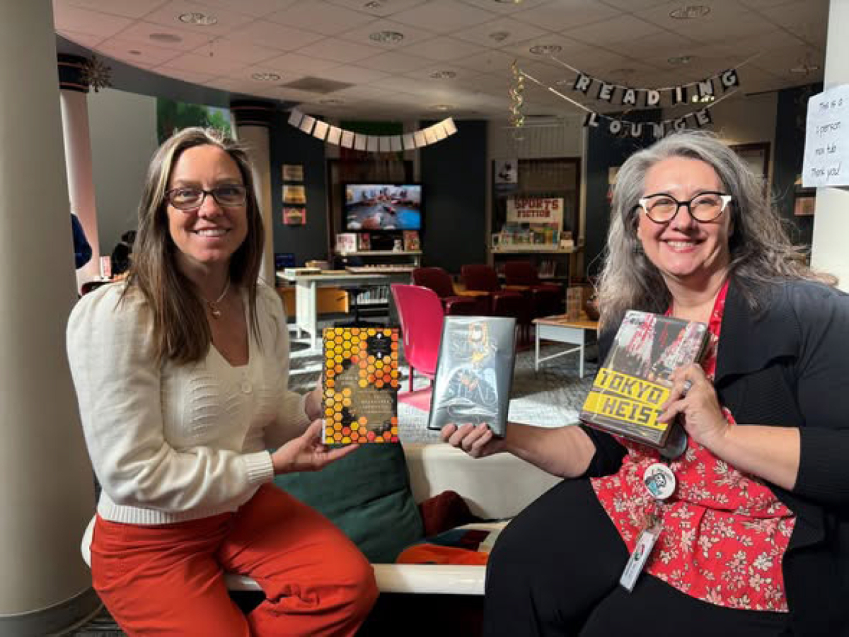 Kimberly Lottig, Skyridge Middle School&rsquo;s library paraprofessional, left, and Skyridge librarian Sarah Logan pose for a photo in the school&rsquo;s library in an undated photo. (Contributed by OnPoint Credit Union)