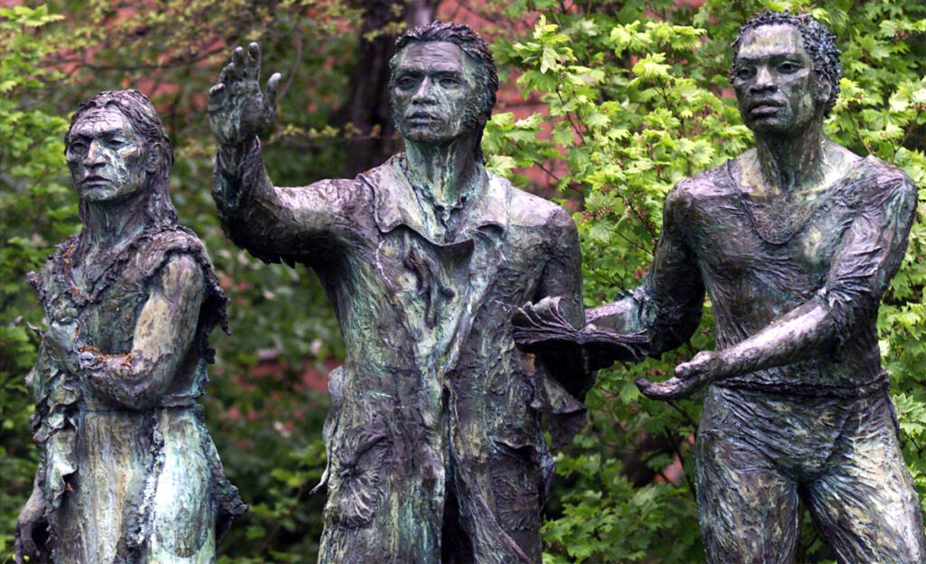 This sculpture of an unnamed Indigenous person, left, William Clark and York was removed by the University of Portland after it became the target of vandalism. (The Columbian files)