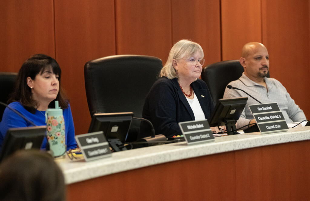 Clark County Councilors Michelle Belkot, from left, Sue Marshall and Wil Fuentes listen to public comment Feb. 11 during a Clark County Council meeting at the Clark County Public Service Center. (Taylor Balkom/The Columbian files)
