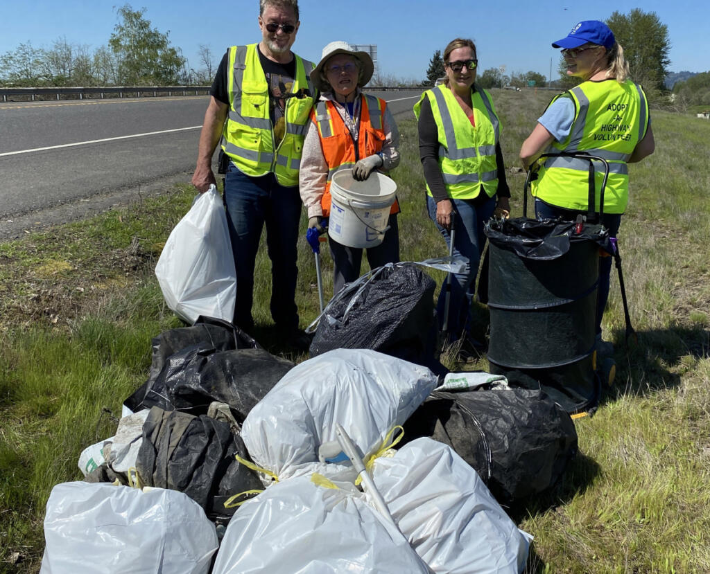 East County Citizens&rsquo; Alliance volunteers, including Mark Silliman, far left, pick up trash off the side of state Highway 14 in Clark County on April 29, 2023. (Photo contributed by Melanie Wilson)