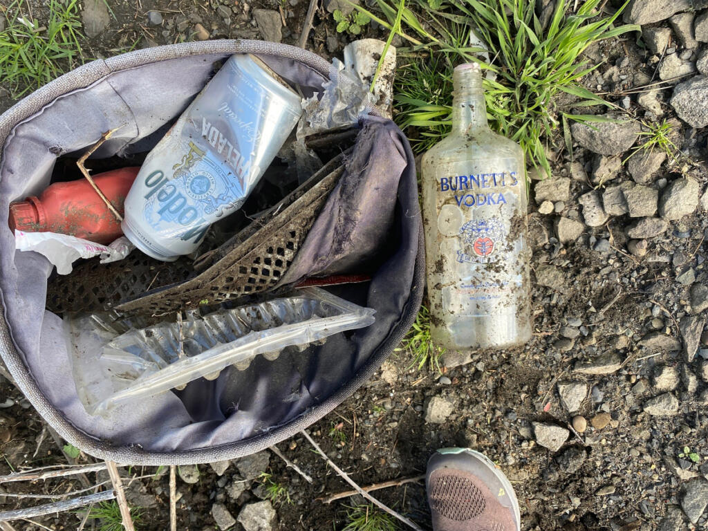 A beer can and vodka bottle are among the garbage littering state Highway 14 in east Clark County in this 2022 photo. (Contributed by Melanie Wilson)