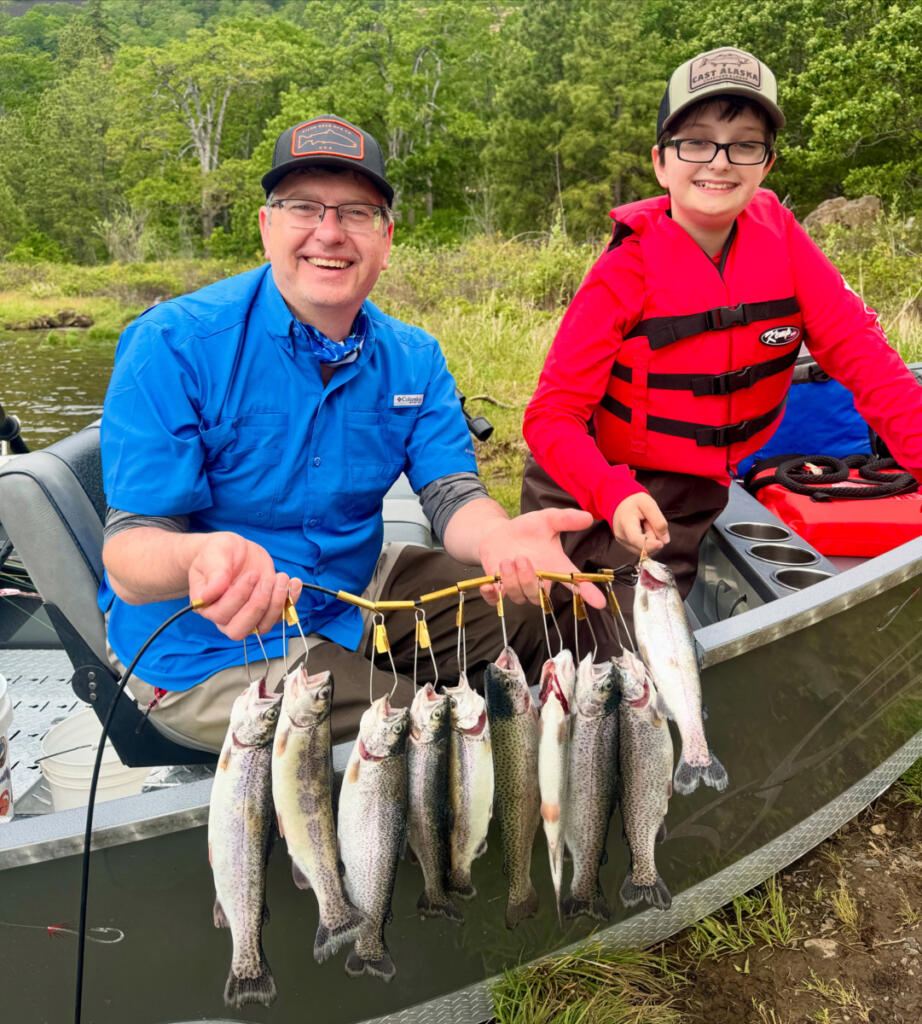 Michael and Sebastion Hass proudly show off a limit of spring trout taken in 2025 during the trout opener at Rowland Lake. (Photo courtesy Michael Hass)