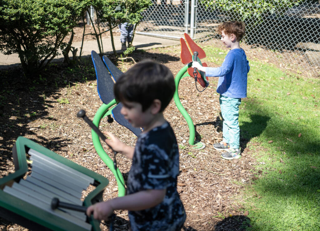 Preschoolers Erland Austad, right, and Marcus Ridge play in a sound garden Thursday morning at the Clark College child care center and lab school in the Child and Family Studies department. The child care center offers early learning education, while also being a crucial resource for student and employee parents, as well as the community.