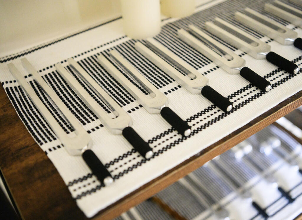 Andrea Kintzley, owner of Soul Space Wellness, uses these tuning forks during one-on-one sound bath sessions. She places the handle on specific areas of the body so that the client can feel the vibrations while hearing the tone. (Taylor Balkom/The Columbian)
