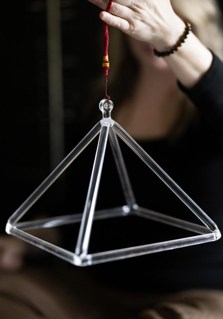 Andrea Kintzley demonstrates a crystal singing pyramid on March 10, 2026, at Soul Space Wellness in Vancouver. This is one of several instruments she plays during sound baths, including crystal and metal singing bowls, chimes and rattles. The sounds and vibrations are believed to promote deep relaxation. (Taylor Balkom/The Columbian)