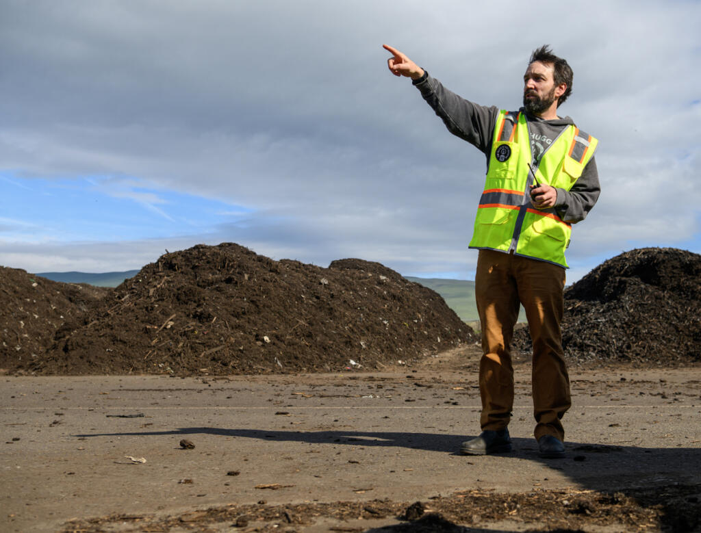 Dirt Hugger co-founder Pierce Louis talks about the company&rsquo;s composting process March 20 at the company&rsquo;s facility in Dallesport. Over 186,000 pounds of food waste from Clark County&rsquo;s We Compost program was trucked to the facility last year. (Taylor Balkom/The Columbian)