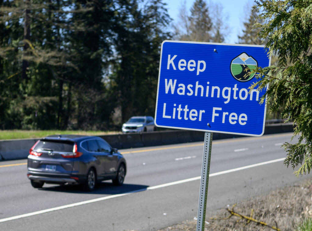 A sign along state Highway 14 encourages motorists to not litter, as seen March 27. (Taylor Balkom/The Columbian)