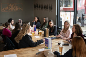 Romance Readers Social Club members chat about books April 1 at Ashwood Taps and Trucks in Washougal. (Taylor Balkom/The Columbian)