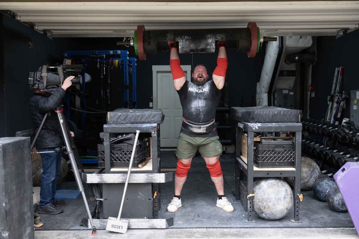 Camas resident Martins Licis, the Latvian-American strongman known worldwide as &ldquo;The Dragon,&rdquo; records a livestreaming workout for his followers while joined by the media at his home April 2. Licis is set to return to the World&rsquo;s Strongest Man competition this week, marking his first appearance since 2022. (Amanda Cowan/The Columbian)