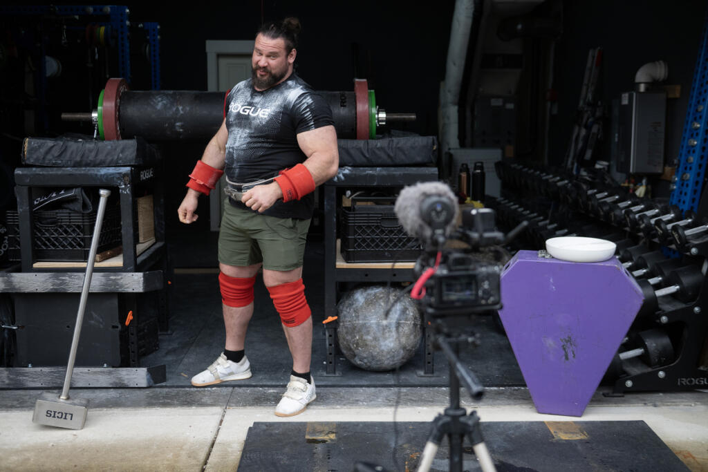Camas resident Martins Licis, the Latvian-American strongman known worldwide as &ldquo;The Dragon,&rdquo; records a livestreaming workout for his followers at his home April 2. Licis is set to return to the World&rsquo;s Strongest Man competition later this week, marking his first appearance since 2022. (Amanda Cowan/The Columbian)