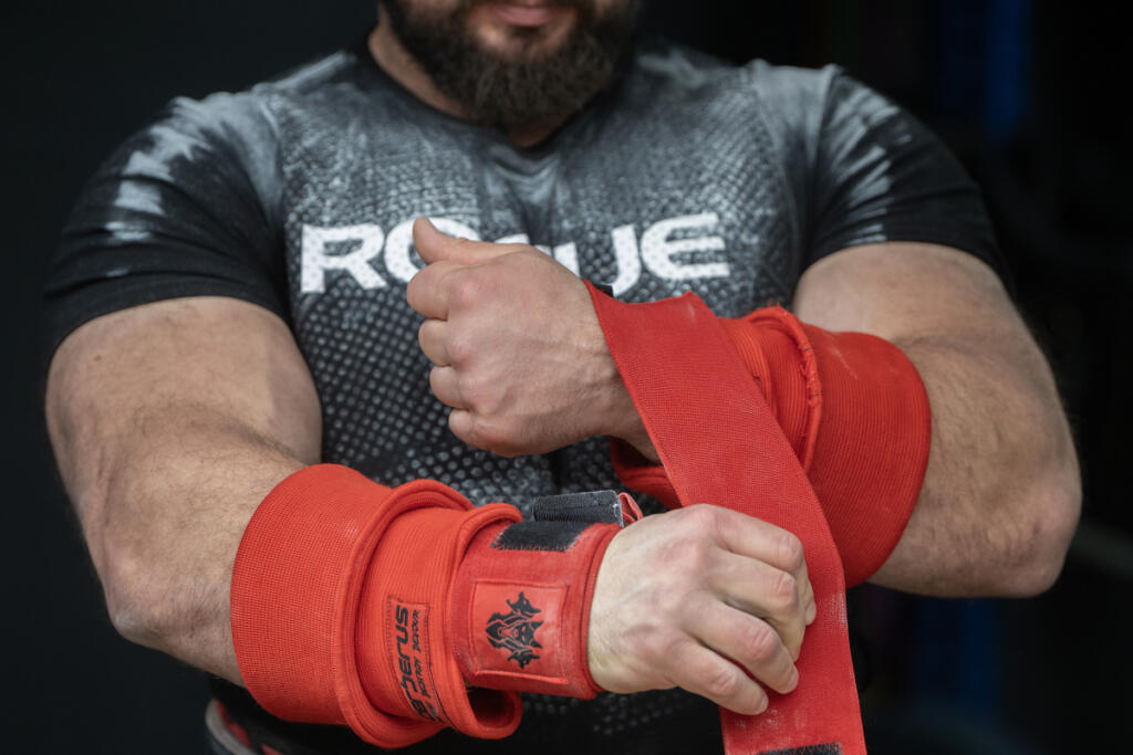 Camas resident Martins Licis gears up as he records a livestreaming workout for his followers at his home April 2. (Amanda Cowan/The Columbian)