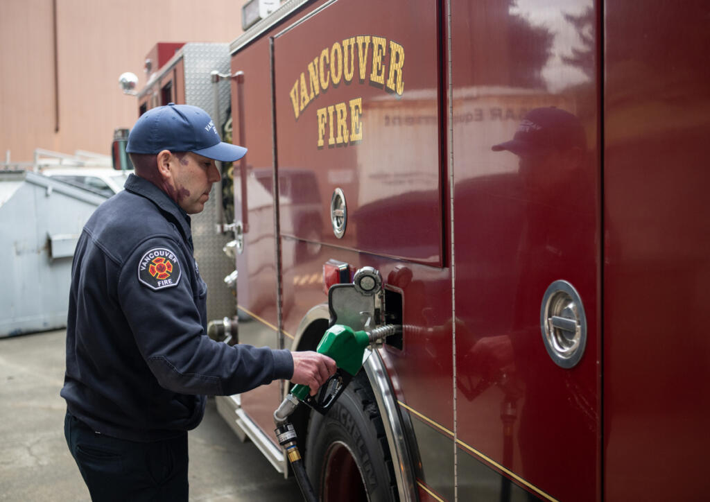 Firefighter Brenton Cooper refuels a rig Tuesday at the Vancouver Fire Department&rsquo;s Station 5 in Vancouver. (Taylor Balkom/The Columbian)