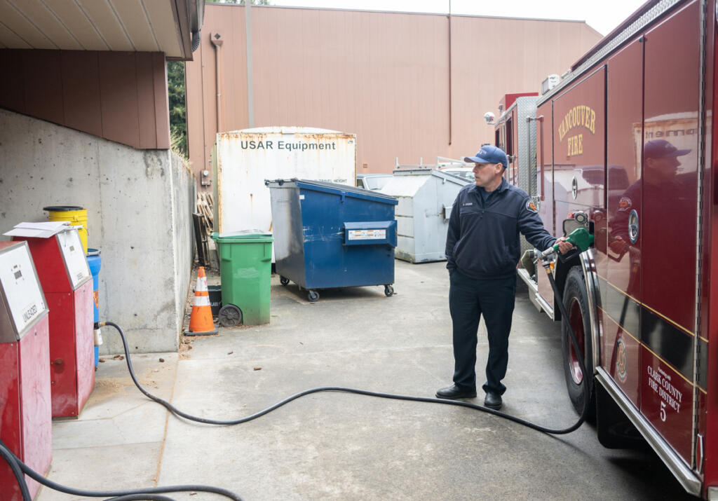 Firefighter Brenton Cooper refuels a rig Tuesday at the Vancouver Fire Department&rsquo;s Station 5 in Vancouver. (Taylor Balkom/The Columbian)
