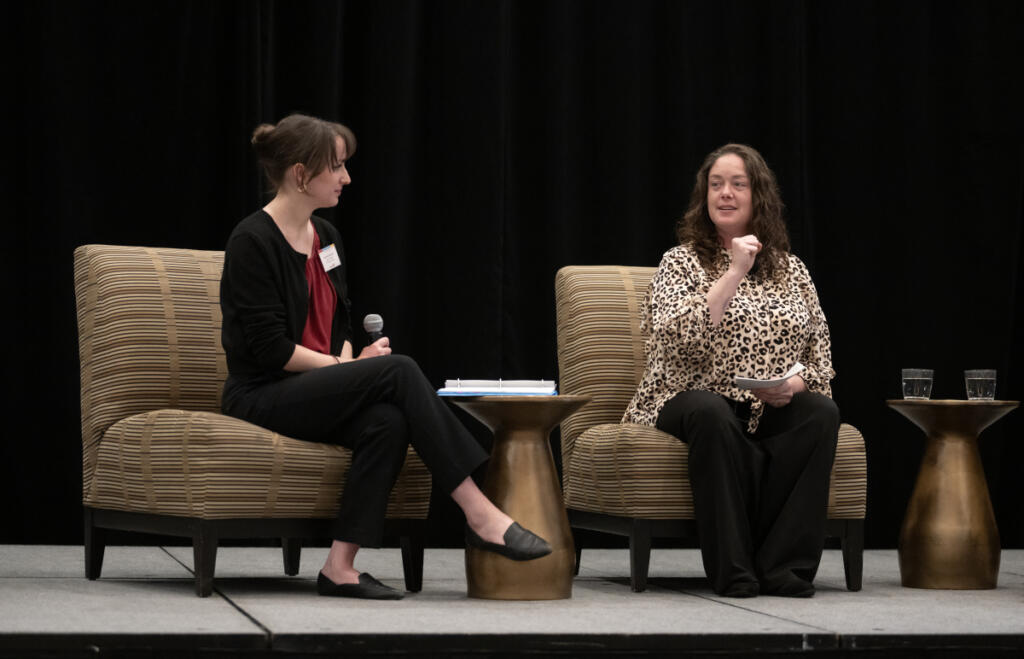 Elizabeth Freisinger of Shared Hope International, left, talks with survivor Yvonne Fryar during a discussion at the Hilton Vancouver Washington on April 9. Shared Hope International hosted a full-day training that brought together educators, law enforcement, medical professionals, youth-serving organizations and social service providers. (Amanda Cowan/The Columbian)