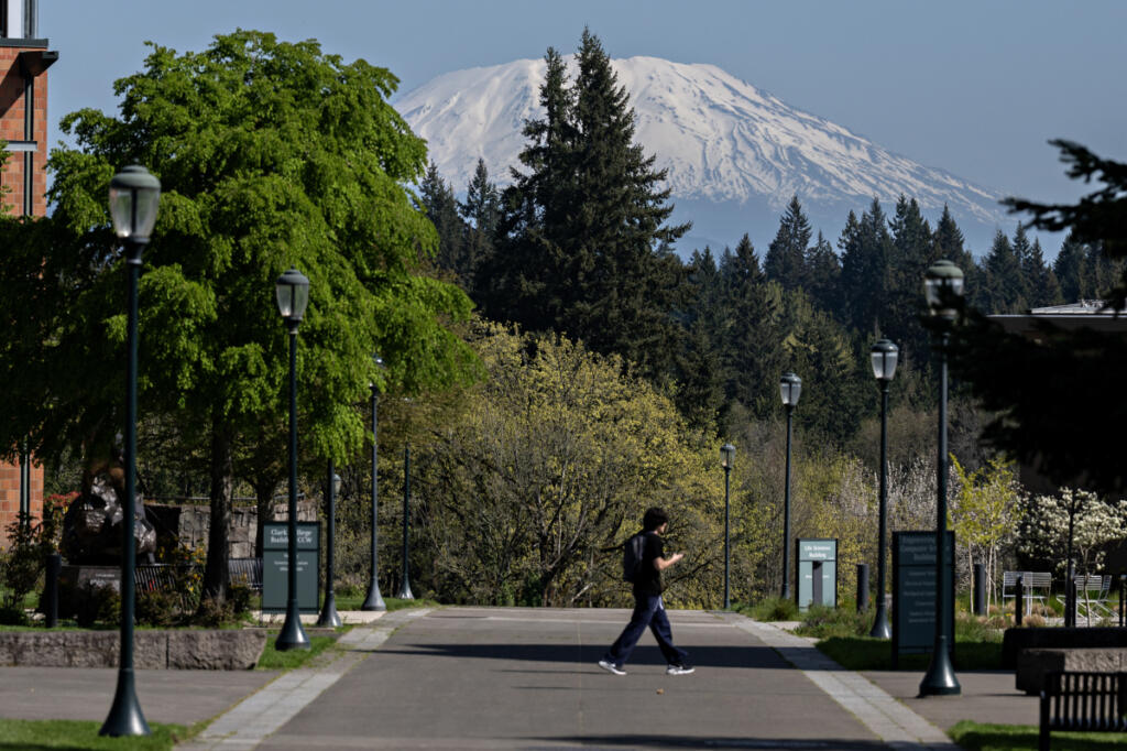 A student walks to class Wednesday at Washington State University Vancouver, which enjoys a view of Mount St. Helens. The Lower Columbia region is at 49 percent of average snowpack. (Photos by Amanda Cowan/The Columbian)