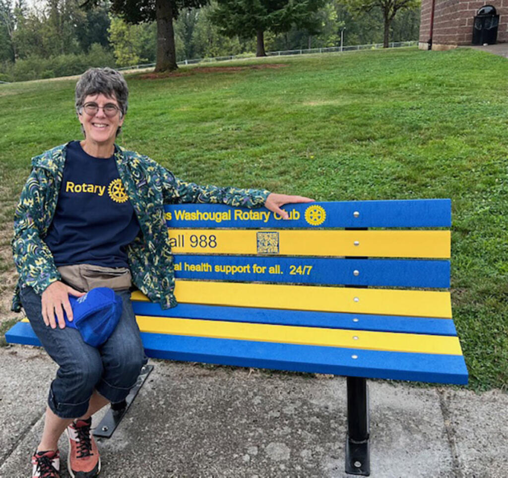Camas-Washougal Rotarian Kathy Bussman sits on a &ldquo;buddy bench&rdquo; at Skyridge Middle School in Camas. (Contributed by George Capacci)