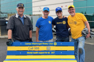 From left to right, Camas-Washougal Rotarians George Capacci, David Bussman, Kathy Bussman and Richard Renton stand behind a &ldquo;buddy bench&rdquo; at Discovery High School in Camas. (Contributed by George Capacci)