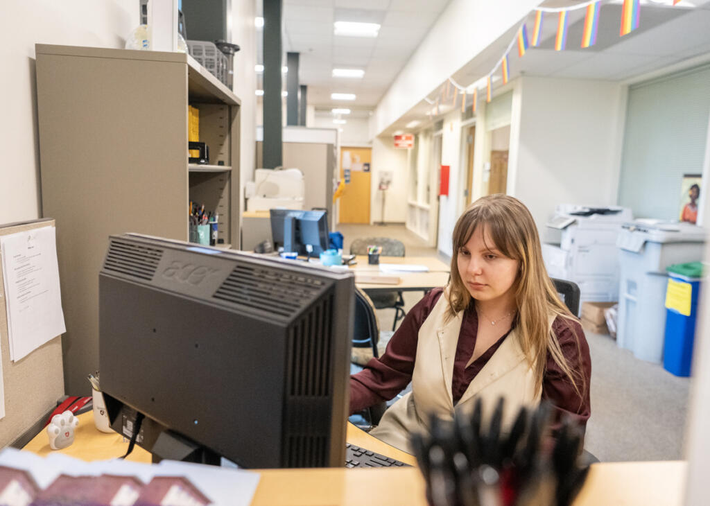 Washington State University Vancouver psychology senior Rebecca Vasilache writes an email April 14 at WSU Vancouver&rsquo;s Career Action Center. Students preparing to graduate from college are facing a weaker job market than in previous years. (Taylor Balkom/The Columbian)