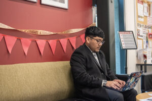 Washington State University Vancouver human development and digital technology and culture senior Joseph Reyes-Hernandez works on a computer April 14 at WSU Vancouver&rsquo;s Career Action Center. (Taylor Balkom/The Columbian)
