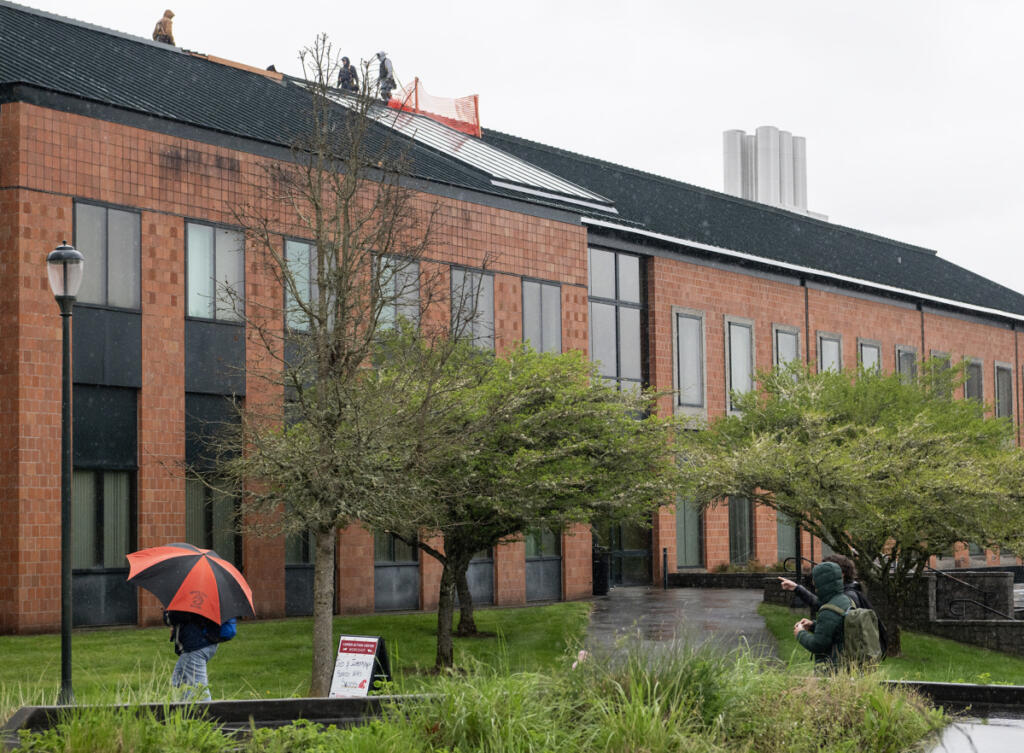 Students walk in front of the Science and Engineering Building on April 14 at Washington State University Vancouver. Staff at the university&rsquo;s Career Action Center are encouraging students to incorporate more relationship building to their job search.