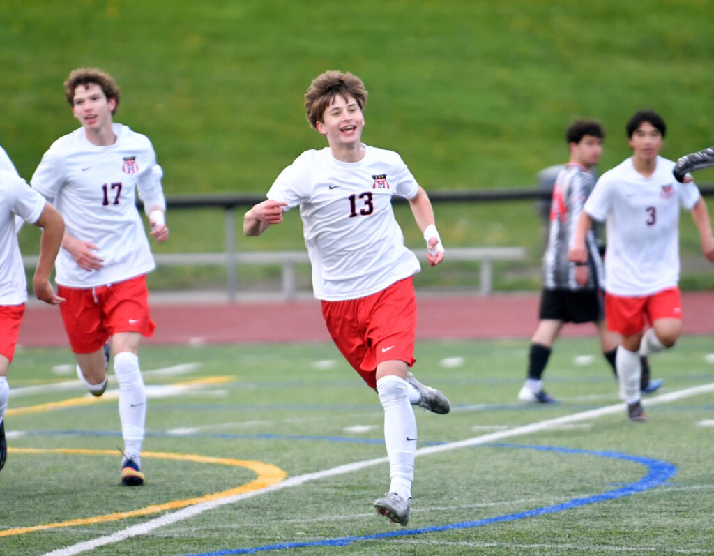 Mark Koroteyev (13) of Camas celebrates after scoring a goal against Union in the first half of a 4A Greater St. Helens League soccer match on Wednesday at Union High School. The Papermakers won the league opener 2-0. (Tim Martinez/The Columbian)