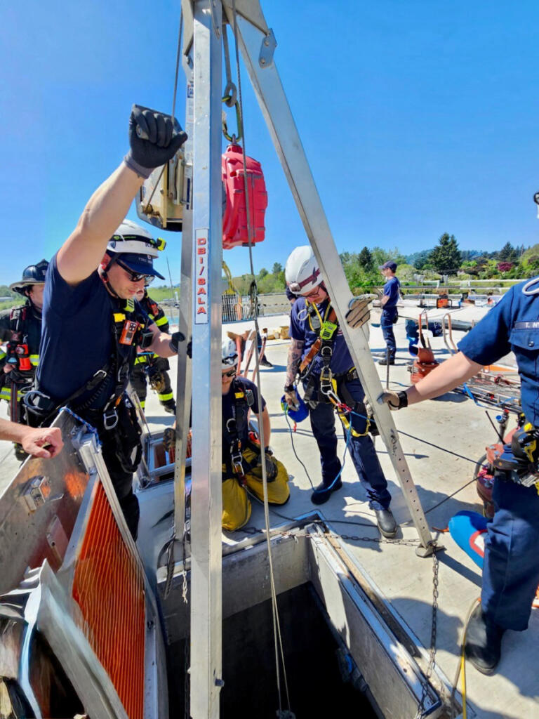 Using cables and ropes, a rescue team Wednesday was able to raise a man who had fallen about 25 feet into a tank at the Washougal Wastewater Treatment Facility from the tank floor to the roof level. (Photo contributed by the Vancouver Fire Department)