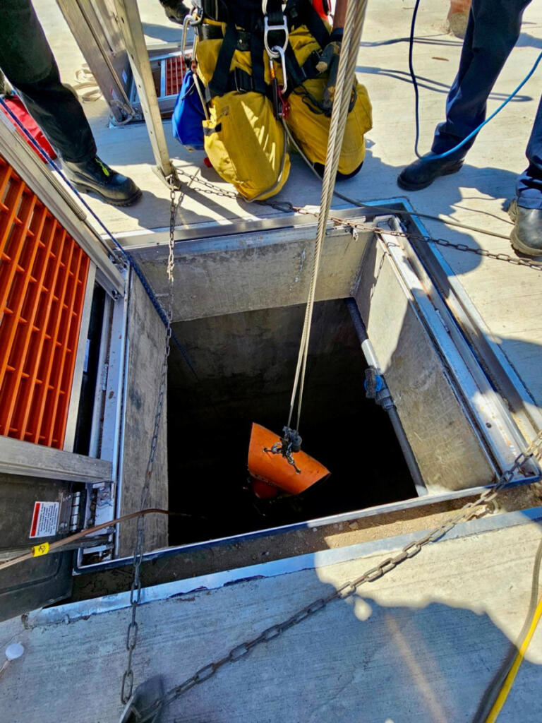 Using cables and ropes, a rescue team Wednesday was able to raise a man who had fallen about 25 feet into a tank at the Washougal Wastewater Treatment Facility from the tank floor to the roof level. (Photo contributed by the Vancouver Fire Department)