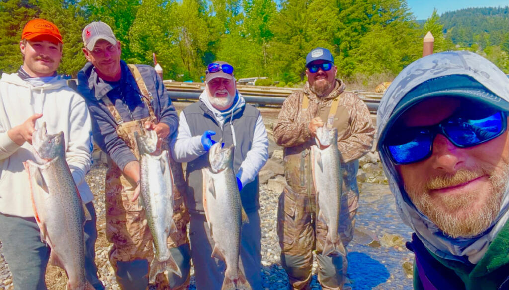 Fishing guide Bill Monroe, foreground, and a boat full of happy anglers with their catch of spring Chinook from the Wind River. The wind offers a quieter experience than can be found at Drano Lake. (Photo courtesy Bill Monroe Outdoors)