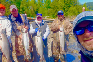 Fishing guide Bill Monroe, foreground, and a boat full of happy anglers with their catch of spring Chinook from the Wind River. The wind offers a quieter experience than can be found at Drano Lake. (Photo courtesy Bill Monroe Outdoors)