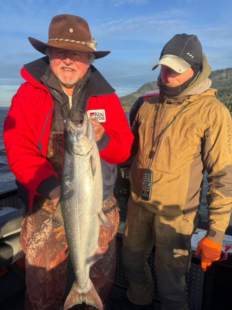 Legendary Northwest angler Buzz Ramsey, left, with a spring Chinook he caught while fishing with guide Bill Monroe. The Wind River offers less crowding and is a more relaxed fishery than Drano Lake. (Photo courtesy Bill Monroe Outdoors)