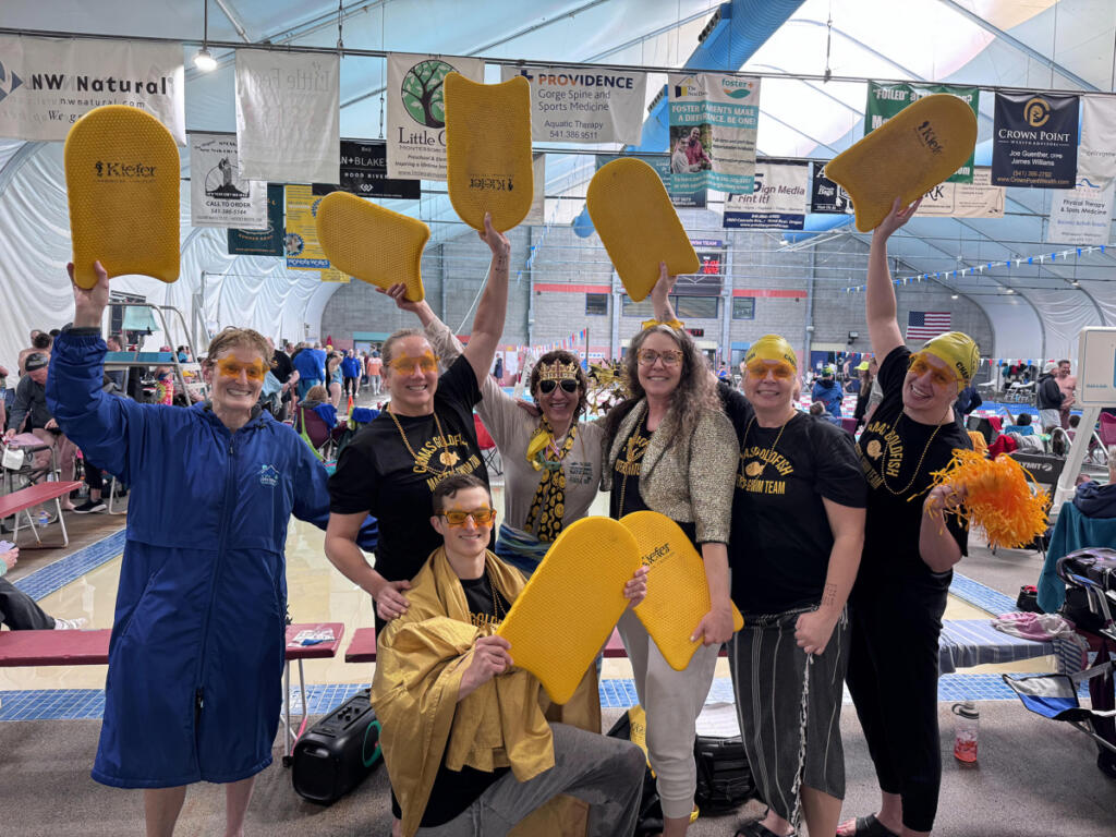 Members of the Camas Goldfish Masters swimming team out of Gold&rsquo;s Gym Camas celebrate winning the Team Spirit Award at the Oregon Masters Swimming Championships on April 19, 2026, in Hood River, Ore. Pictured are (from left) Nancy Vincent, Angela Fladlovich, Brian Vincent, Lauren Wickholm, Sarah Dunn, Kelly Dean and Stacey Ostrin (Photo courtesy of Sarah Dunn)