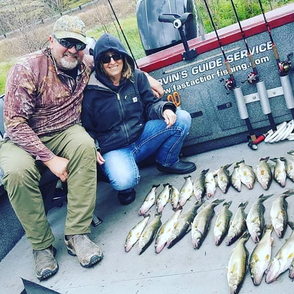 A couple happy anglers with a mess of fine-eating walleye. This good haul was caught while fishing with Marvin Henkel&rsquo;s Guide Service.