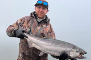 Fishing guide Casey Kelly of NW Columbia Fishing Adventures shows off a fine lower Columbia River spring Chinook he took earlier this year. The season reopener will give anglers a chance to land the finest table salmon to be found in the Columbia River. (Photo courtesy of Casey Kelly)