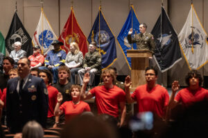 Lt. Col. John Scott, at podium, leads an oath of enlistment for military recruits April 22 during an event for future military service members at Skyview High School. About 90 high-schoolers were celebrated for enlisting in the military. (Taylor Balkom/The Columbian)