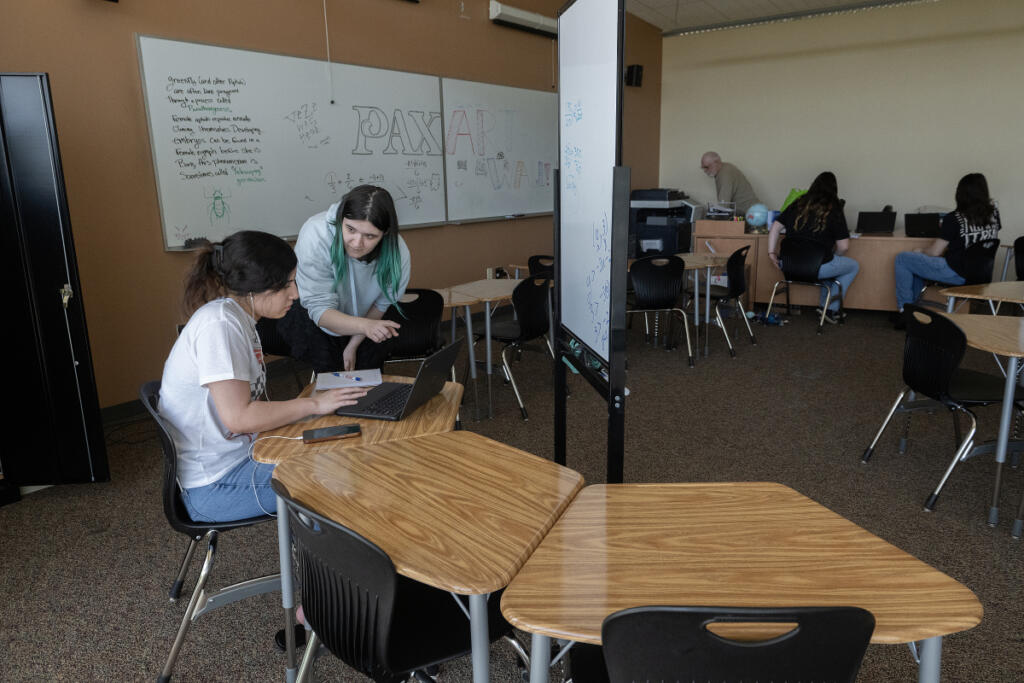 PAX Learning Center student Jessica Zarate, left, works with Mya Smirke, tutor and GED coordinator, during class at Clark College&rsquo;s Columbia Tech Center campus on Monday afternoon. (Photos by Amanda Cowan/The Columbian)