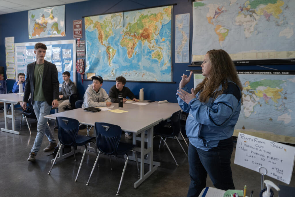 Student teacher Kyle Effinger, left, listens as teacher Angela Redinger speaks to the class Friday afternoon at Hockinson High School. (Photos by Amanda Cowan/The Columbian)