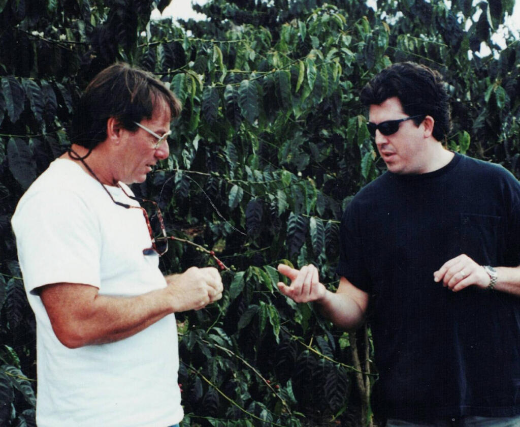 David Knight, left, gives a tour to a coffee buyer in Hawaii in the early 2000s. (Contributed by David Knight)