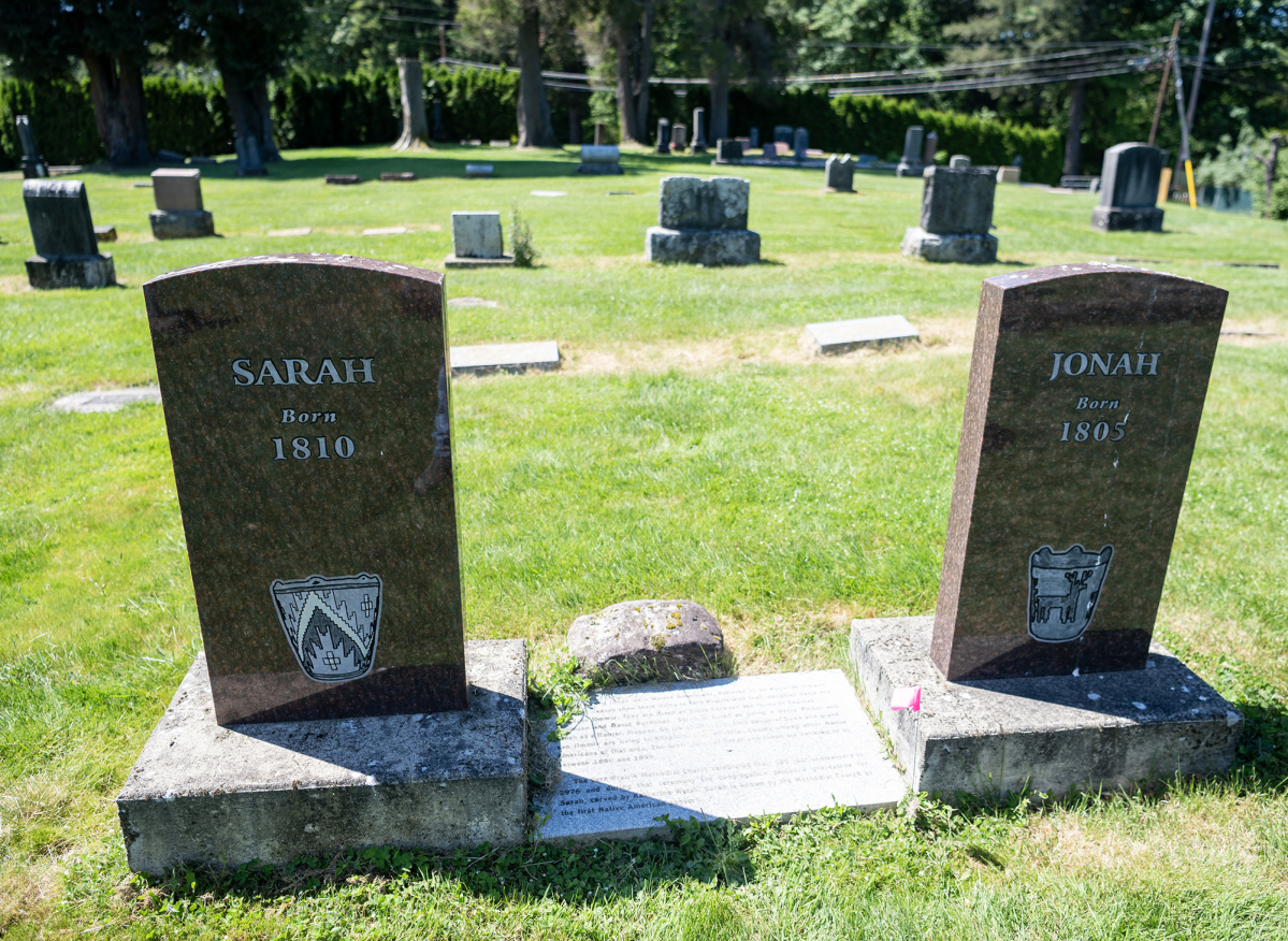 Headstones for two Native Americans buried at Fern Prairie Cemetery sit Monday at Fern Prairie Cemetery in Camas. Local historian Peri Muhich is leading the Two River Heritage Museum&rsquo;s first tour of the cemetery on Sunday. (Taylor Balkom/The Columbian)