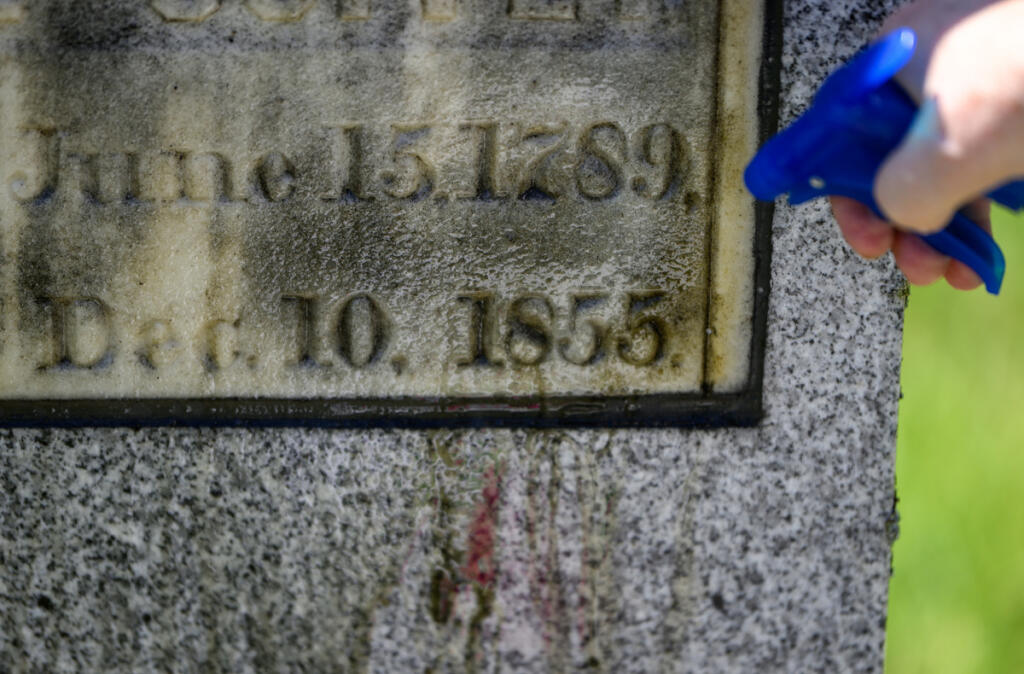 Local historian Peri Muhich says the headstones at older cemeteries tell stories about the people buried there. (Taylor Balkom/The Columbian)